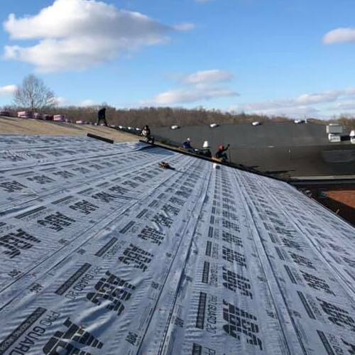 Roofers Installing a New Roof.