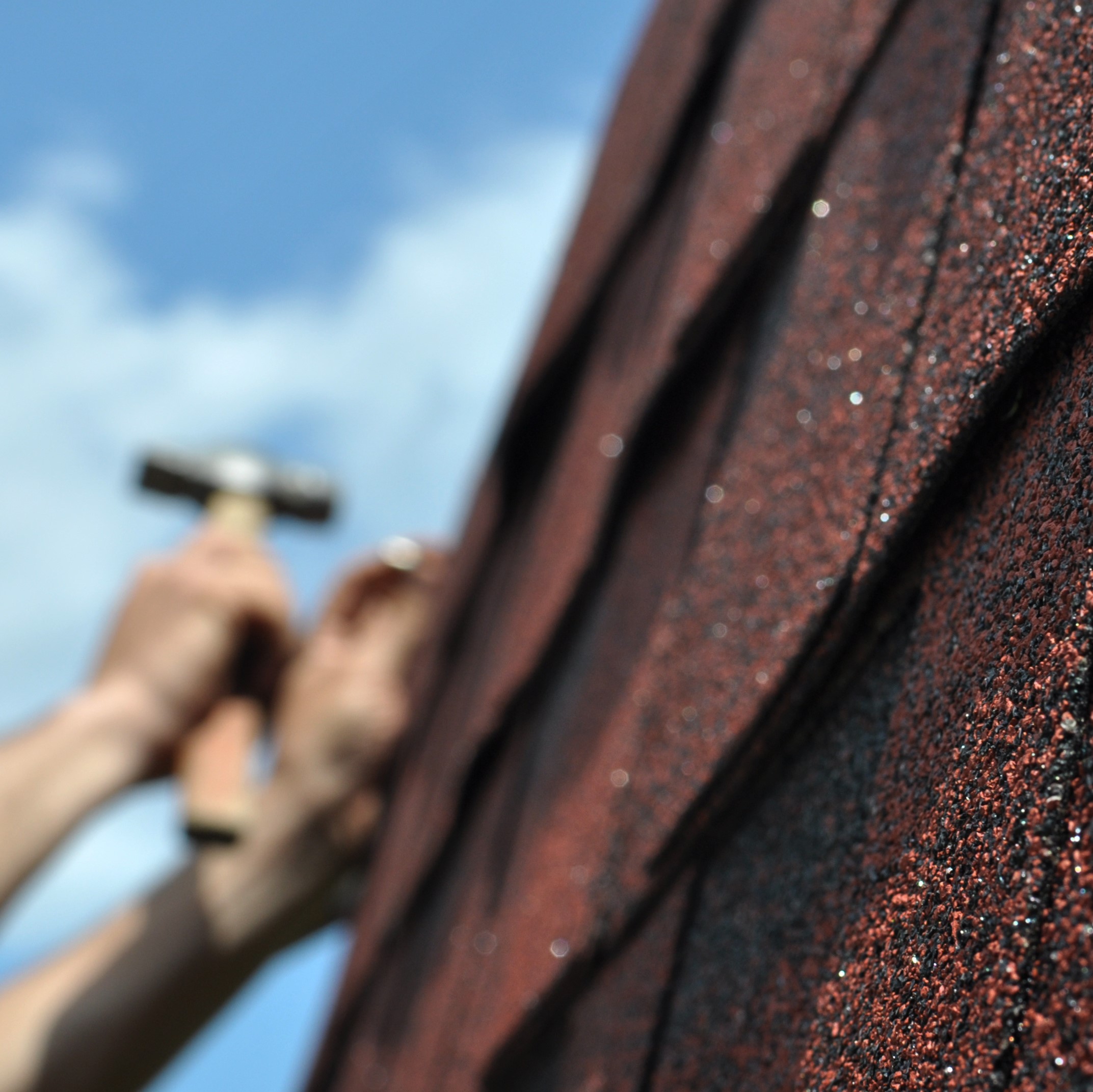 A Roofer Makes Repairs.